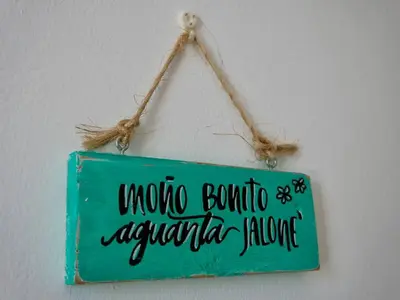 a sign hanging on a wall with the words wrong bombula argento aquaria at Lovely condo at Blue Sea Tower near Juan Dolio beach in Juan Pedro