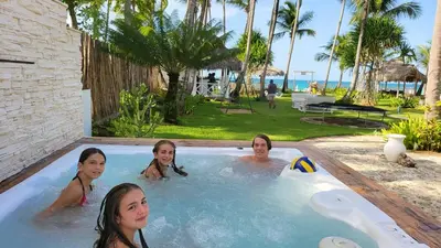 a group of women in a jacuzzi at a resort at Hotel Casa Coson in Las Terrenas