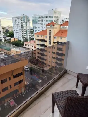 a balcony with a view of a city with buildings at Brickell Hotel apto g 08 Santo Domingo Bella Vista in Santo Domingo