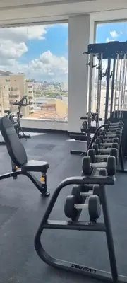 a gym with rows of treadmills and a large window at Brickell Hotel apto g 08 Santo Domingo Bella Vista in Santo Domingo