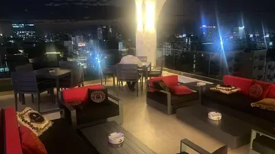 a restaurant with a view of a city at night at Brickell Hotel apto g 08 Santo Domingo Bella Vista in Santo Domingo