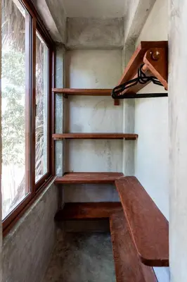 a room with wooden shelves and a window at El Valle Villas in Santa Bárbara de Samaná