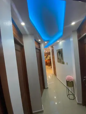 a hallway with a blue ceiling and a stool at VIP Home in Santiago de los Caballeros