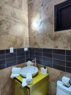 a bathroom with a sink and a toilet at Hotel La Casona MC in La Romana