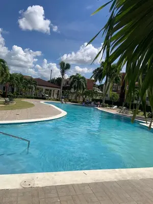 a large pool with blue water in a resort at Luxury apartment with Pool in Santiago de los Caballeros