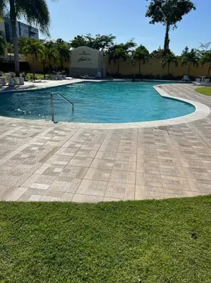 a swimming pool with blue water in a resort at Luxury apartment with Pool in Santiago de los Caballeros