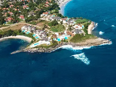 an aerial view of a small island in the ocean at Peninsula Esmeralda Luxury Hotel & Villas in San Felipe de Puerto Plata