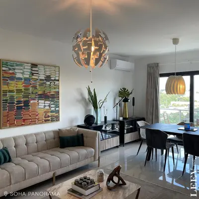 a living room with a couch and a table at Soha panorama- A14- 2 dormitorios in Santiago de los Caballeros