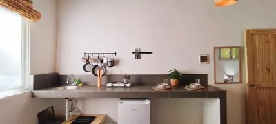 a kitchen with a sink and a counter with utensils at Kite House Cabarete across Kite Beach in Cabarete