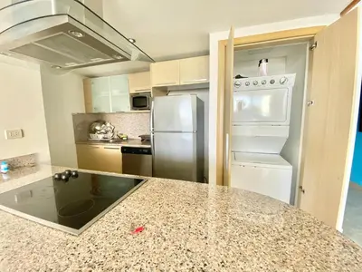 a kitchen with a counter top and a refrigerator at 703 Marbella 2 bedrooms Beachfront Beautiful Apartment in San Pedro de Macorís