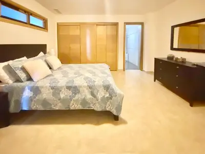 a large bedroom with a bed and a dresser at 703 Marbella 2 bedrooms Beachfront Beautiful Apartment in San Pedro de Macorís