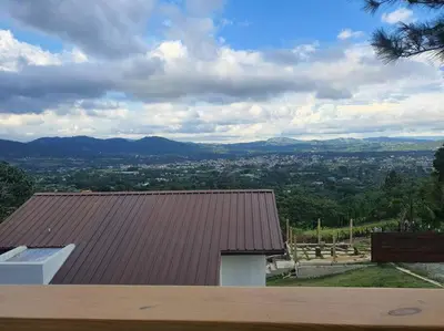 a roof of a house with a view of a city at Villa en la montaña in Jarabacoa