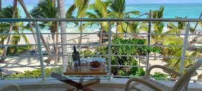 a view of the beach from the balcony of a resort at Private room overlooking the beach in Punta Cana