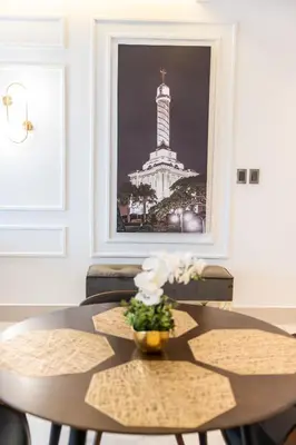 a dining room table with a picture of the washington monument at Top Floor in Luxury Tower in Santiago de los Caballeros