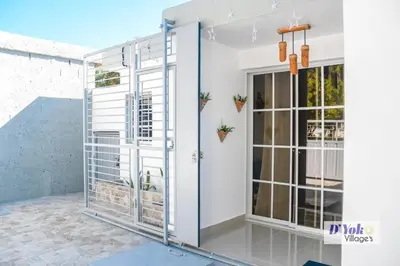 a room with a glass door with plants at D´ Yoko Village´s in Pedernales