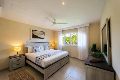 a bedroom with a bed and a window at Special Offer, Iberostar Apartment Milagro 3BDR Pool, Beach in Punta Cana