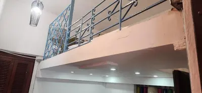 a stairwell in a room with a stair railing at Colonial apartment for up to 4 person in Santo Domingo