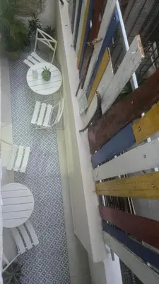 an overhead view of a balcony with chairs and a table at Colonial apartment for up to 4 person in Santo Domingo