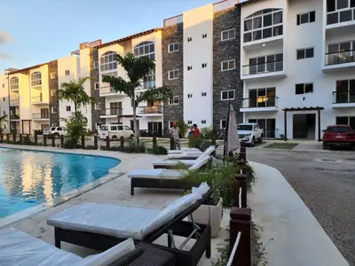 a hotel with a swimming pool and buildings at Armonia De Las Terrenas Gorgeous Penthouse in Las Terrenas