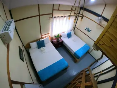 an overhead view of a room with two beds at Rustic House Punta Rucia in Punta Rucia