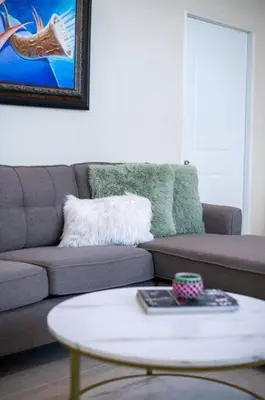 a living room with a couch and a table at Suite 10 en la Zona Colonial in Santo Domingo