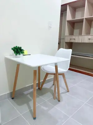 a white table and a white chair in a kitchen at Sunset Home 2B (Gated) in Higuey