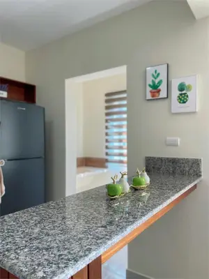 a kitchen with a counter with green apples on it at Sunset Home 2B (Gated) in Higuey