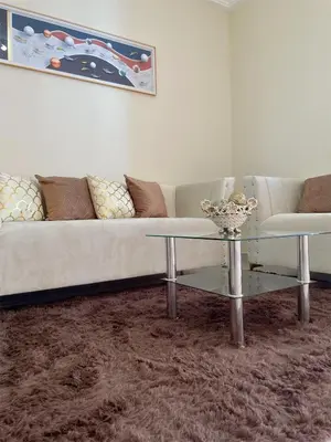 a living room with a couch and a table at Sunset Home 2B (Gated) in Higuey
