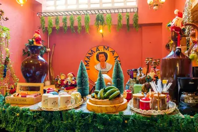 a table with christmas items on it in a room at Hostal Mamà Mambò - Zona Colonial in Santo Domingo