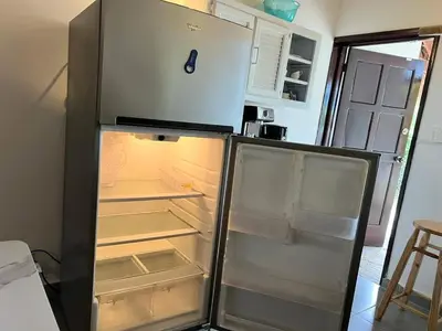 a refrigerator with its door open in a kitchen at Playa Bonita 4 minute walk from our private Villa Anantara Bonita in Las Terrenas