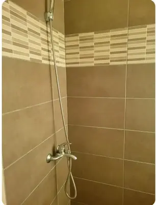 a shower with a shower head in a bathroom at Amplio apartmento in Santo Domingo