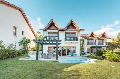 an exterior view of a house with a swimming pool at Magnificent Villa at Puerto Bahia in Sabana
