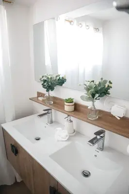 a bathroom with a white sink and a mirror at Salt Air & City Vibe Awaits! Just Minutes to Beach in San Felipe de Puerto Plata