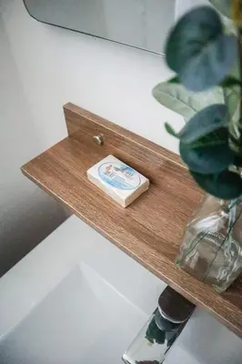 a wooden shelf with a bar of soap on it at Salt Air & City Vibe Awaits! Just Minutes to Beach in San Felipe de Puerto Plata