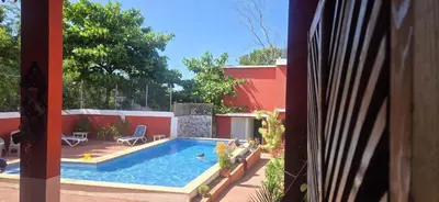 a swimming pool in the backyard of a house at Villa KIKI Ensenada in Punta Rucia