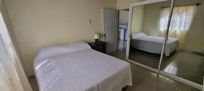 a bedroom with a mirror and a bed in it at Margarita in Río San Juan