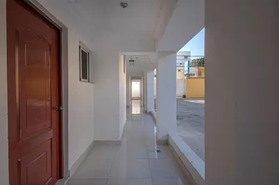 an empty hallway of a building with a door at Premium Single Room Fast Wi-Fi Santo Domingo Este in La Viva