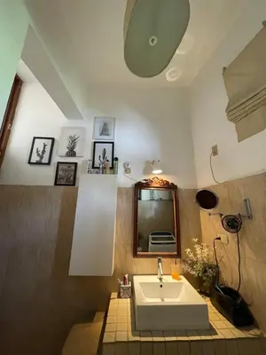 a bathroom with a sink and a mirror at Centrico ciudad colonial in Santo Domingo