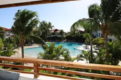 a view of a pool from the balcony of a resort at Paraiso Bayahibe by Mireya in Bayahibe