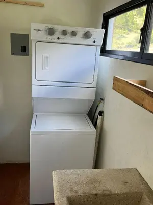 a white refrigerator in a kitchen with a window at La Casita de Charo 2, vive y siente el amor, creando recuerdos de vida!! in Constanza