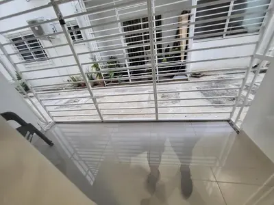 a person standing in front of a window in a room at Hermoso y comodo apartamento in Santiago de los Caballeros