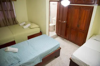 a small bedroom with two beds and a bathroom at Spacious 2Br 2Bath Apartment Terrace & Street View in La Viva