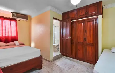 a small bedroom with two beds and a bathroom at Spacious 2Br 2Bath Apartment Terrace & Street View in La Viva