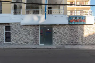 a building with a sign on the side of it at Spacious 2Br 2Bath Apartment Terrace & Street View in La Viva