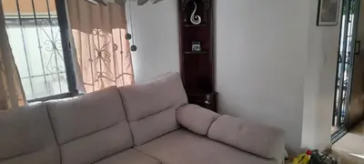 a living room with a couch and a window at Villa Isabel, NO SMOKING, cerca embajada USA in Santo Domingo