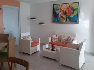 a living room with chairs and a painting on the wall at Best bed and breakfast in Samana Breakfast Included in Santa Bárbara de Samaná