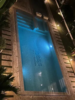 a swimming pool at night with the words hotel sidx at Beach Garden I F3 Luxury Condo in Punta Cana