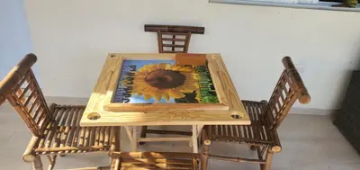 a wooden table with a sunflower painted on it at Sunflower village villa girasoles in Jarabacoa