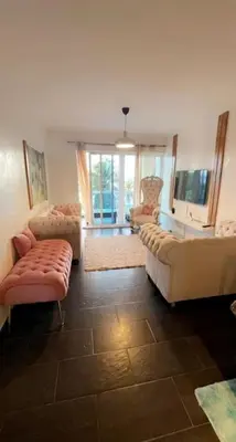 a living room with two couches and a tub at Dpto Dream Village Boca Chica frente a la playa in Boca Chica