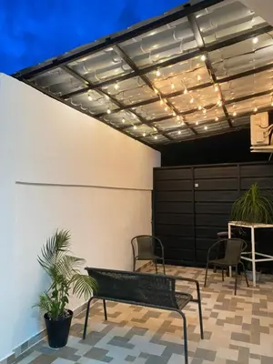 a patio with a bench and a table with plants at Only Room By Merengue House, 8 minutos airport in Monte Adentro